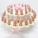 TORTA ROSA 15/25/40 FETTE: UNA BOMBONIERA DOLCE E GIOIOSA CON STATUINE JOLLY BIMBA E TAMBURELLO