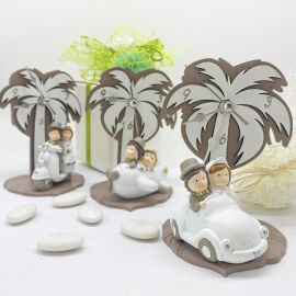 IL TEMPO DEL NOSTRO VIAGGIO: BOMBONIERA MATRIMONIO - OROLOGIO DA TAVOLO CON PALMA E SPOSI IN MACCHINA O IN VESPA O IN AEREO.