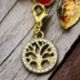 CIONDOLO DORATO CON ALBERO DELLA VITA E STRASS