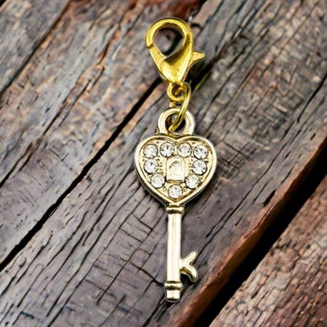 CHARM DORATO A FORMA DI CHIAVE CON BRILLANTINI