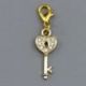 CHARM DORATO A FORMA DI CHIAVE CON BRILLANTINI