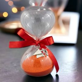 CLESSIDRA SABBIA ROSSA CON FIOCCO E CIONDOLO TOCCO ARGENTATO