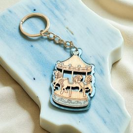 PORTACHIAVI GIOSTRINA CAROSELLO CON SFONDO CELESTE NASCITA BIMBO