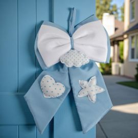 FIOCCO NASCITA BIMBO IN TESSUTO CELESTE E BIANCO PER DECORAZIONE NASCITA