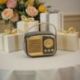 BOMBONIERA SPEAKER BLUETOOTH VINTAGE NERO E ORO PER EVENTI UNICI
