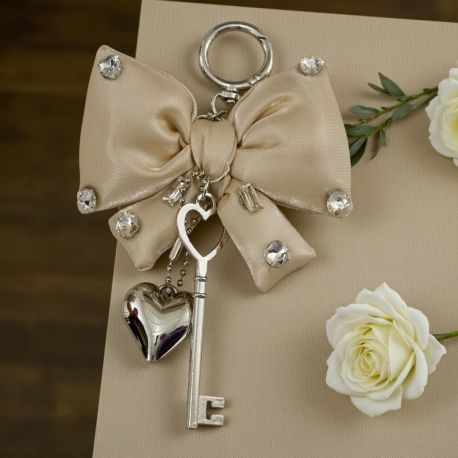 CIONDOLO A FORMA DI FIOCCO BIANCO CON STRASS: BOMBONIERA PER OGNI OCCASIONE